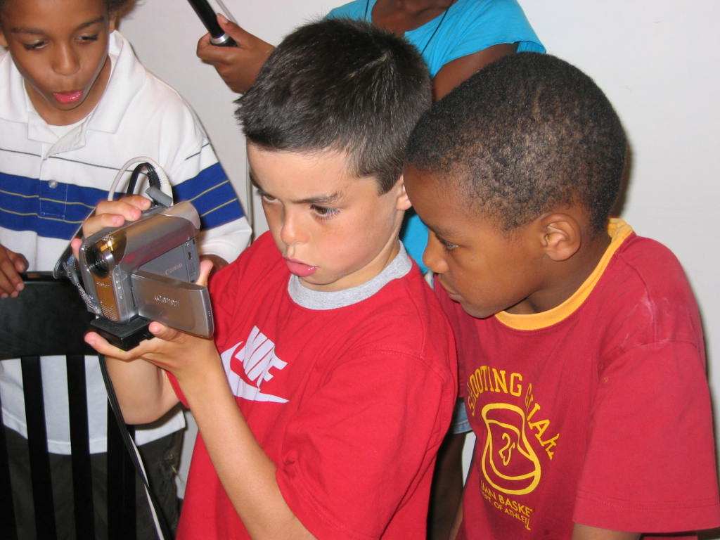 Children using video camera